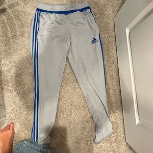 Adidas Gray Sweatpants. Blue Stripe. Size M. Zippers on the bottom of pants.